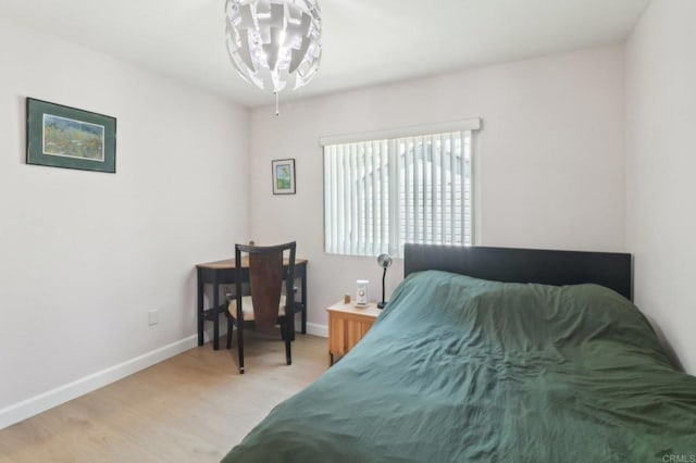 4294 Panorama Dr, La Mesa, CA 91941 - bedroom featuring light wood-style floors, baseboards, and a chandelier