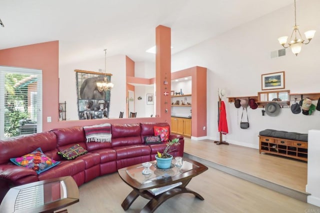 4294 Panorama Dr, La Mesa, CA 91941 - living room with a chandelier, lofted ceiling, wood finished floors, and baseboards