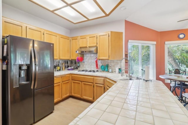 4294 Panorama Dr, La Mesa, CA 91941 - kitchen featuring stainless steel fridge, tile countertops, a sink, under cabinet range hood, and lofted ceiling