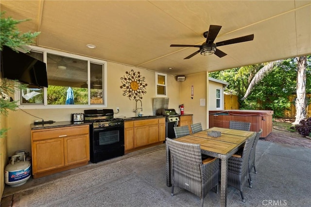 225 W 12th St, Chico, CA 95928 - view of patio with a hot tub, a ceiling fan, outdoor dining area, and a sink