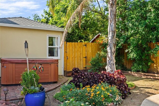 225 W 12th St, Chico, CA 95928 - fenced backyard featuring a hot tub