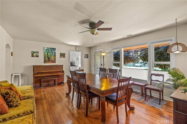 225 W 12th St, Chico, CA 95928 - dining area with a ceiling fan, hardwood / wood-style flooring, and arched walkways