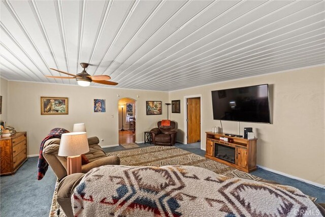 225 W 12th St, Chico, CA 95928 - living room featuring carpet floors, arched walkways, ceiling fan, and baseboards