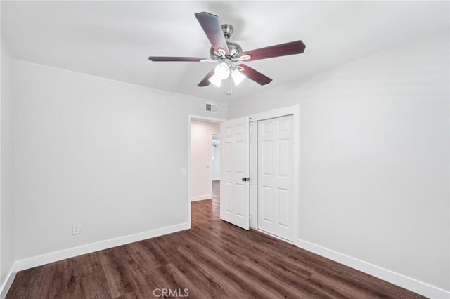 1762 Bern Dr, Corona, CA 92882 - unfurnished bedroom with dark wood-type flooring, baseboards, a closet, and a ceiling fan
