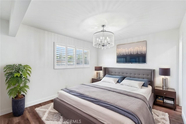 1762 Bern Dr, Corona, CA 92882 - bedroom with a chandelier, wood finished floors, and baseboards
