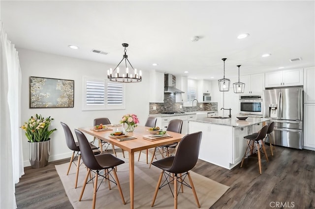 1762 Bern Dr, Corona, CA 92882 - dining area featuring dark wood finished floors, recessed lighting, a chandelier, and baseboards