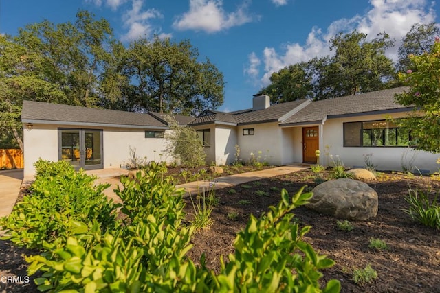1068 Cuyama Rd, Ojai, CA 93023 - ranch-style home with a chimney, stucco siding, and french doors