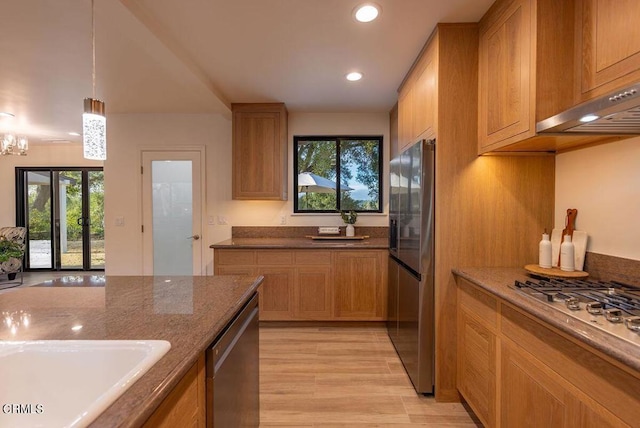1068 Cuyama Rd, Ojai, CA 93023 - kitchen featuring appliances with stainless steel finishes, recessed lighting, dark stone counters, under cabinet range hood, and light wood-style floors