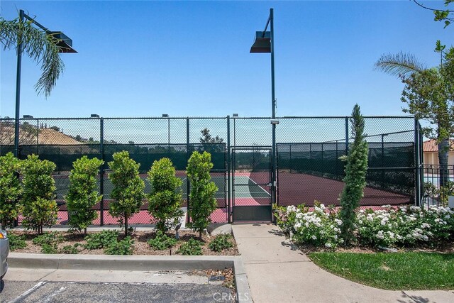 11884 Mariposa Bay Ln, Porter Ranch, CA 91326 - view of tennis court featuring a gate