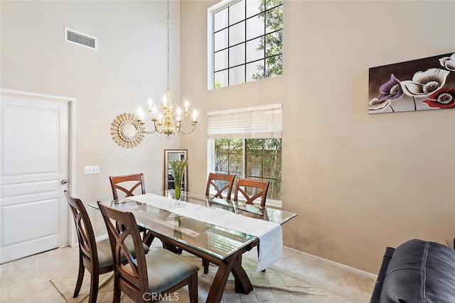 11884 Mariposa Bay Ln, Porter Ranch, CA 91326 - dining room featuring a chandelier, a high ceiling, baseboards, and light colored carpet