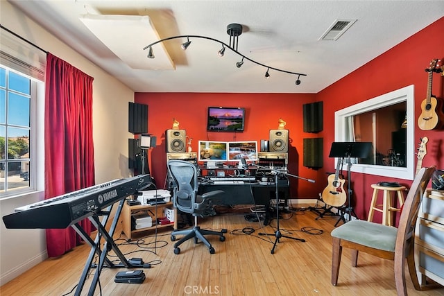 11884 Mariposa Bay Ln, Porter Ranch, CA 91326 - home office featuring wood-type flooring, baseboards, and track lighting