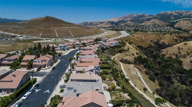 11884 Mariposa Bay Ln, Porter Ranch, CA 91326 - aerial view of property's location featuring a mountainous background and nearby suburban area