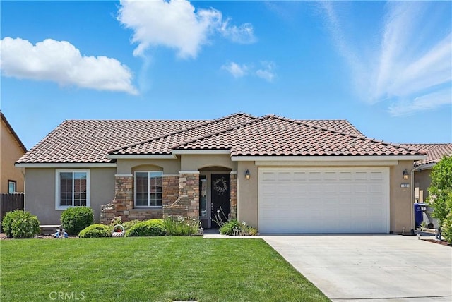 1929 Pollitt Ct, Atwater, CA 95301 - mediterranean / spanish-style home featuring stucco siding, driveway, a front yard, an attached garage, and a tiled roof