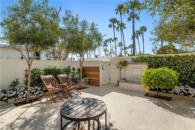 741 Avocado Ave Unit 101, Corona Del Mar, CA 92625 - fenced backyard featuring a patio