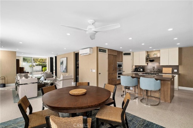 741 Avocado Ave Unit 101, Corona Del Mar, CA 92625 - dining space with an AC wall unit, recessed lighting, baseboards, and ceiling fan