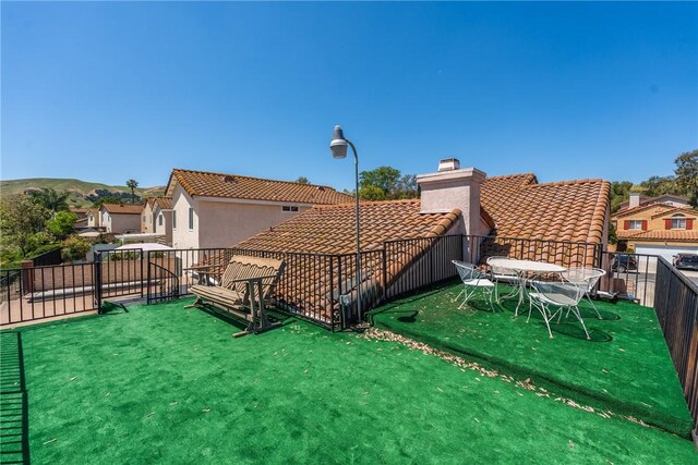 16051 Augusta Dr, Chino Hills, CA 91709 - rear view of property featuring a tile roof, a chimney, and a balcony