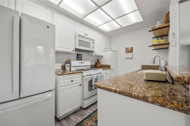 16404 Leffingwell Rd, Whittier, CA 90603 - kitchen featuring white appliances, white cabinets, open shelves, a sink, and light wood finished floors