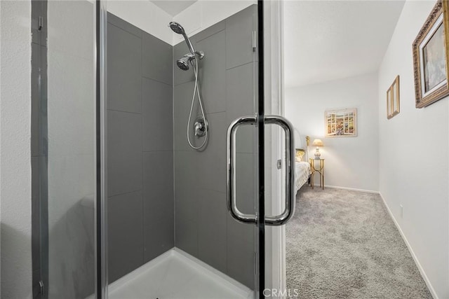 16404 Leffingwell Rd, Whittier, CA 90603 - bathroom featuring a stall shower, baseboards, and connected bathroom