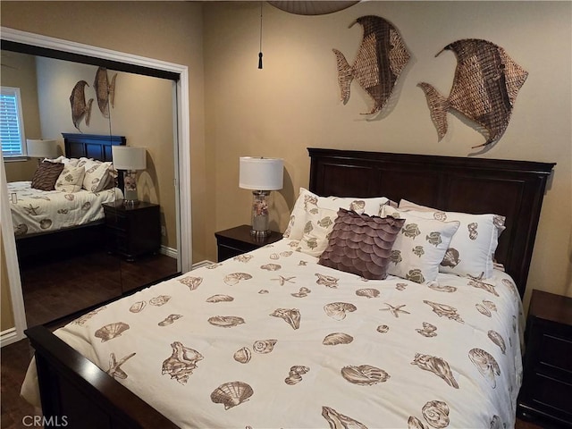 249 Loyola Rd, Costa Mesa, CA 92626 - bedroom featuring a closet, baseboards, and dark wood-type flooring