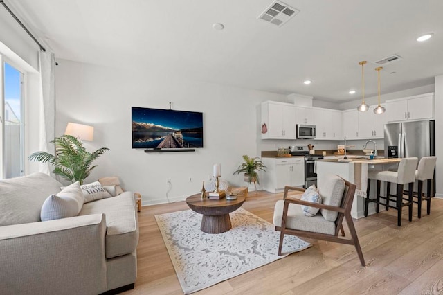 35180 Grove Trl, Fallbrook, CA 92028 - living room with light wood-type flooring, recessed lighting, and baseboards