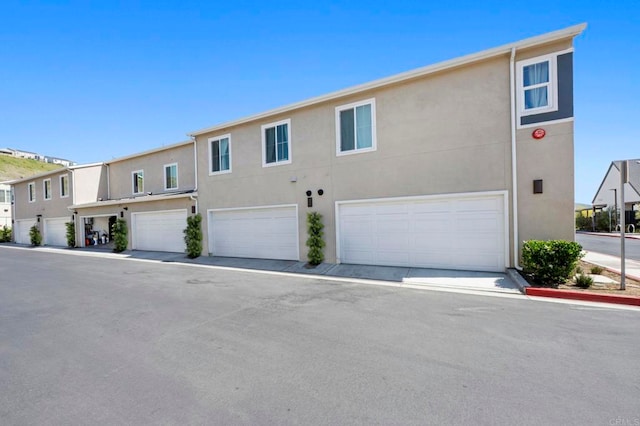 35180 Grove Trl, Fallbrook, CA 92028 - townhome / multi-family property with stucco siding and an attached garage