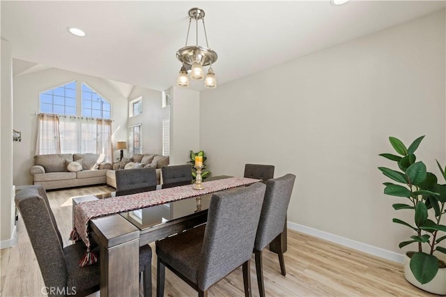 3314 Sandstone Ct, Palmdale, CA 93551 - dining area with baseboards, light wood-style flooring, and lofted ceiling