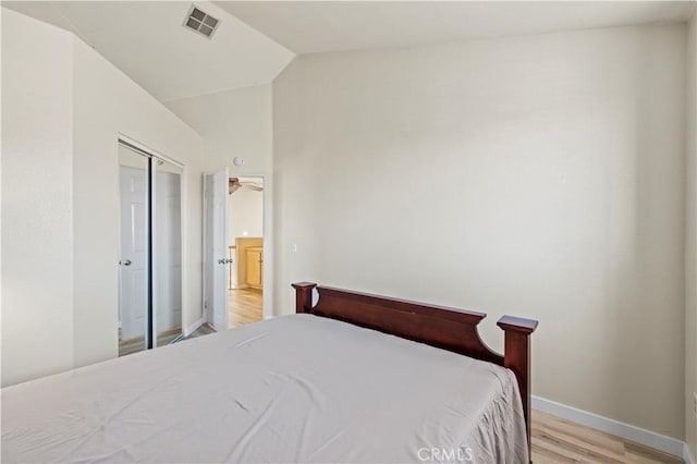 3314 Sandstone Ct, Palmdale, CA 93551 - bedroom featuring light wood-style floors, vaulted ceiling, and baseboards