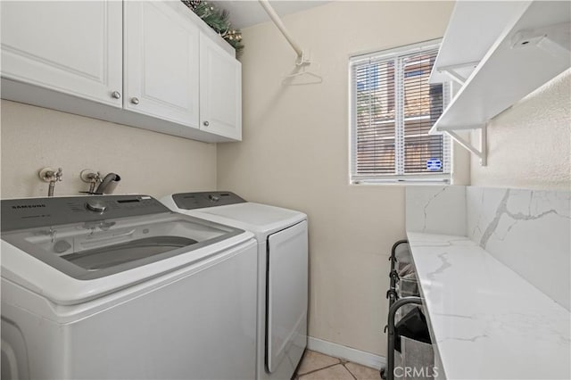 3314 Sandstone Ct, Palmdale, CA 93551 - laundry area featuring separate washer and dryer, cabinet space, light tile patterned flooring, and baseboards