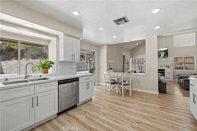 3314 Sandstone Ct, Palmdale, CA 93551 - kitchen with dishwasher, a sink, recessed lighting, baseboards, and light wood-type flooring