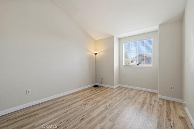 3314 Sandstone Ct, Palmdale, CA 93551 - unfurnished room featuring light wood-style flooring, baseboards, and vaulted ceiling