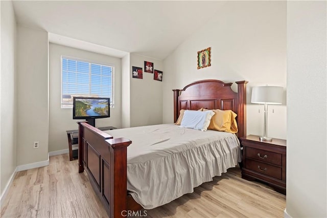 3314 Sandstone Ct, Palmdale, CA 93551 - bedroom with light wood-style floors, lofted ceiling, and baseboards