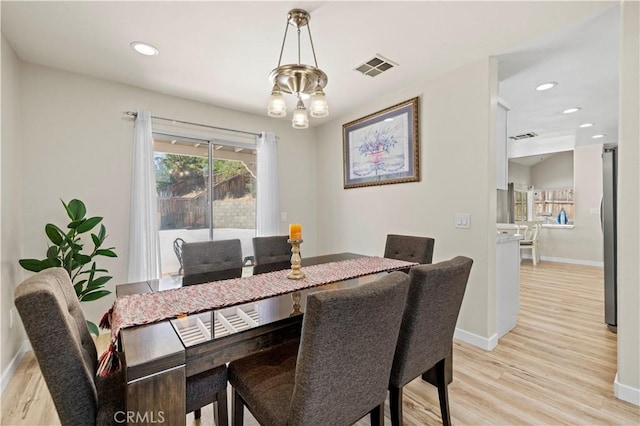 3314 Sandstone Ct, Palmdale, CA 93551 - dining space featuring light wood finished floors, baseboards, recessed lighting, and a chandelier