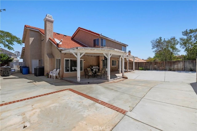 3314 Sandstone Ct, Palmdale, CA 93551 - rear view of house featuring a pergola, a tile roof, cooling unit, a chimney, and stucco siding