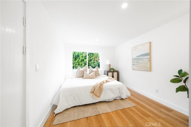 957 S Gramercy Dr Unit 105, Los Angeles, CA 90019 - bedroom featuring baseboards, light wood finished floors, and recessed lighting