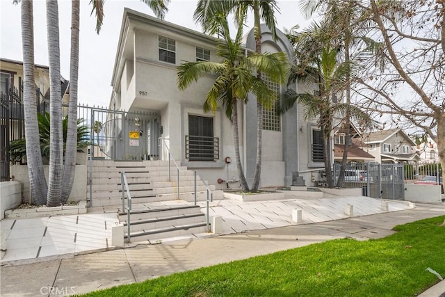 957 S Gramercy Dr Unit 105, Los Angeles, CA 90019 - view of front of property featuring stucco siding