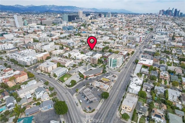 957 S Gramercy Dr Unit 105, Los Angeles, CA 90019 - aerial view of property and surrounding area featuring nearby urban area and mountains