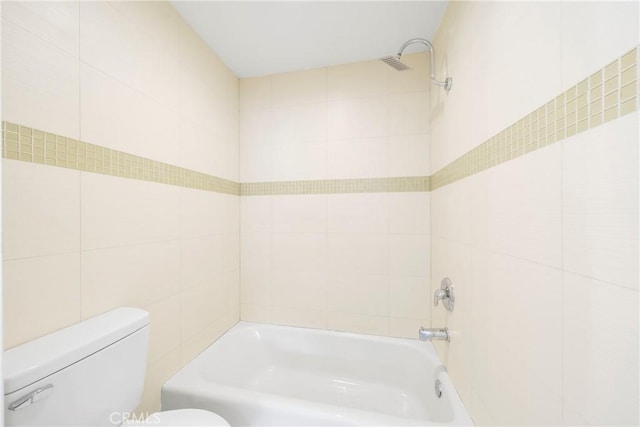 957 S Gramercy Dr Unit 105, Los Angeles, CA 90019 - full bathroom featuring toilet, tile walls, and  shower combination