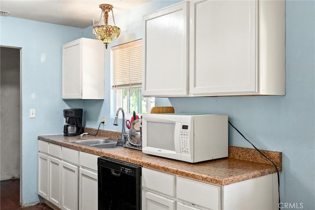 1524 Keko St, Oroville, CA 95965 - kitchen with white microwave, dishwasher, a sink, and white cabinetry