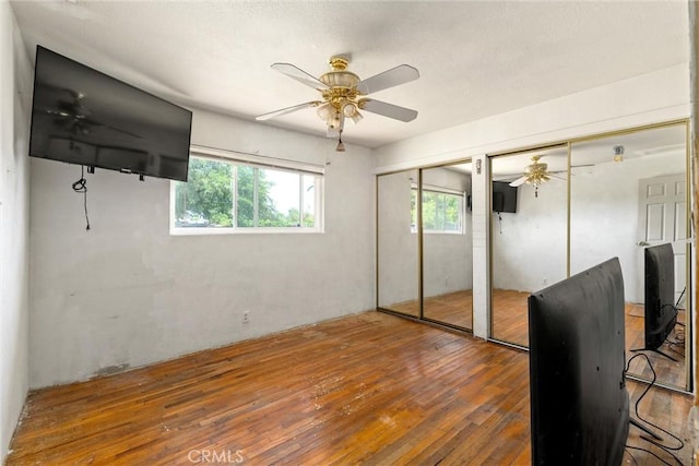 1524 Keko St, Oroville, CA 95965 - unfurnished bedroom with two closets, wood-type flooring, and ceiling fan