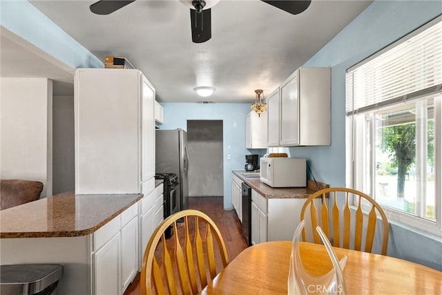 1524 Keko St, Oroville, CA 95965 - kitchen with white microwave, a ceiling fan, dishwasher, and white cabinetry