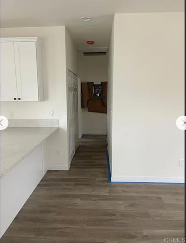 12426 Oaklawn Ave, Chula Vista, CA 91910 - hall featuring dark wood-style flooring and baseboards