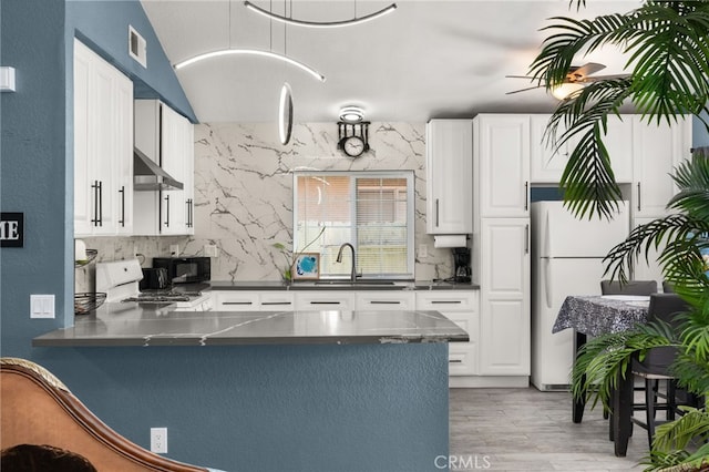 24457 Liolios Way, Moreno Valley, CA 92551 - kitchen with stainless steel countertops, freestanding refrigerator, a sink, white cabinets, and range