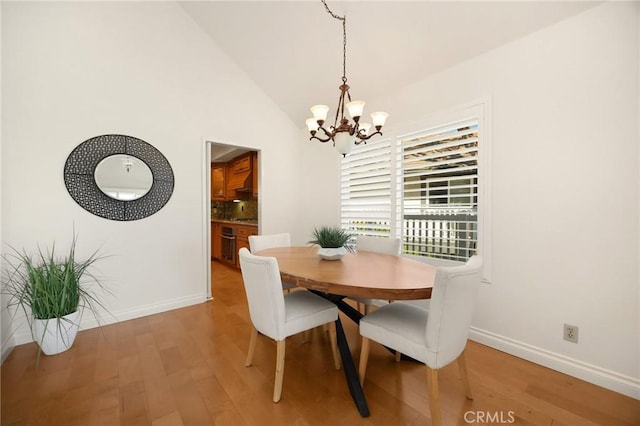 2365 Sommerset Dr, Brea, CA 92821 - dining room with a chandelier, light wood-style flooring, baseboards, and vaulted ceiling