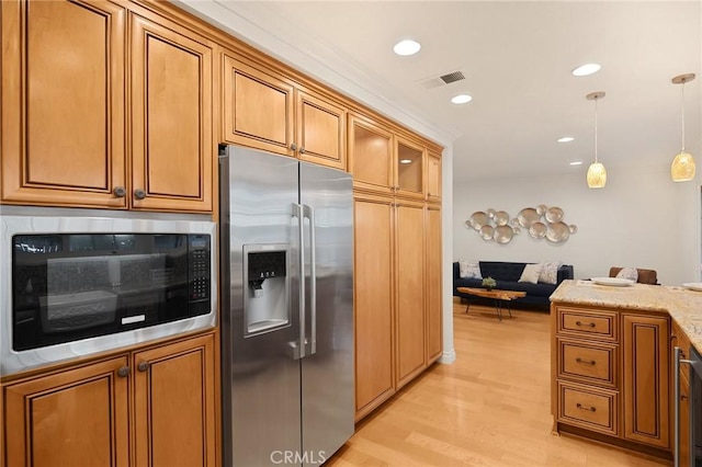 2365 Sommerset Dr, Brea, CA 92821 - kitchen featuring stainless steel fridge, built in microwave, brown cabinets, light wood-style flooring, and recessed lighting