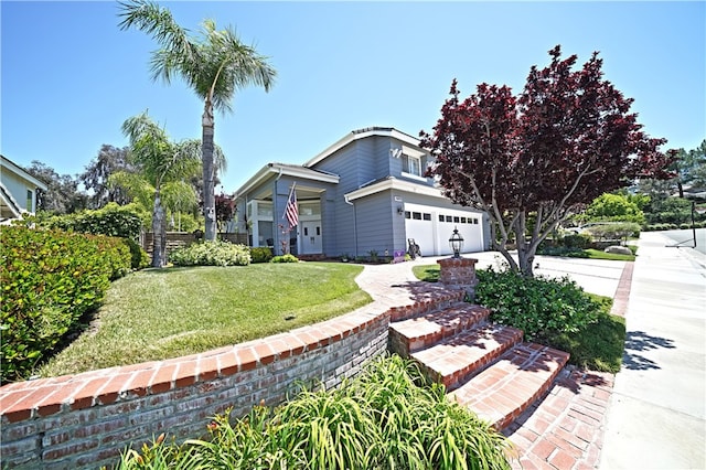 27324 Chesterfield Dr, Valencia, CA 91354 - view of front facade featuring a front yard, a garage, and driveway
