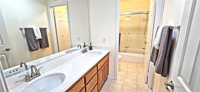 27324 Chesterfield Dr, Valencia, CA 91354 - full bath featuring double vanity, toilet, tile patterned floors, and bath / shower combo with glass door