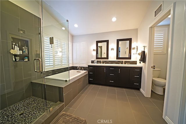 27324 Chesterfield Dr, Valencia, CA 91354 - bathroom featuring a bath, double vanity, toilet, a stall shower, and tile patterned flooring