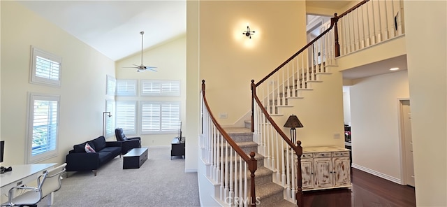 27324 Chesterfield Dr, Valencia, CA 91354 - staircase featuring high vaulted ceiling, baseboards, ceiling fan, and carpet