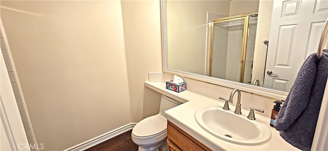 27324 Chesterfield Dr, Valencia, CA 91354 - bathroom featuring vanity, a tile shower, toilet, baseboards, and wood finished floors