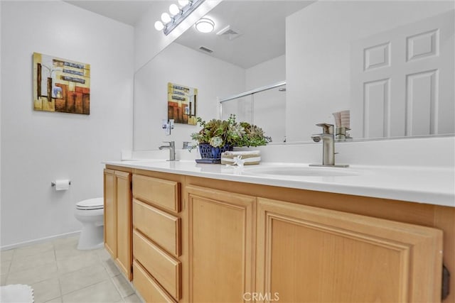 62 Rio Grande St, Fillmore, CA 93015 - full bath featuring double vanity, toilet, tile patterned flooring, a shower with shower door, and baseboards
